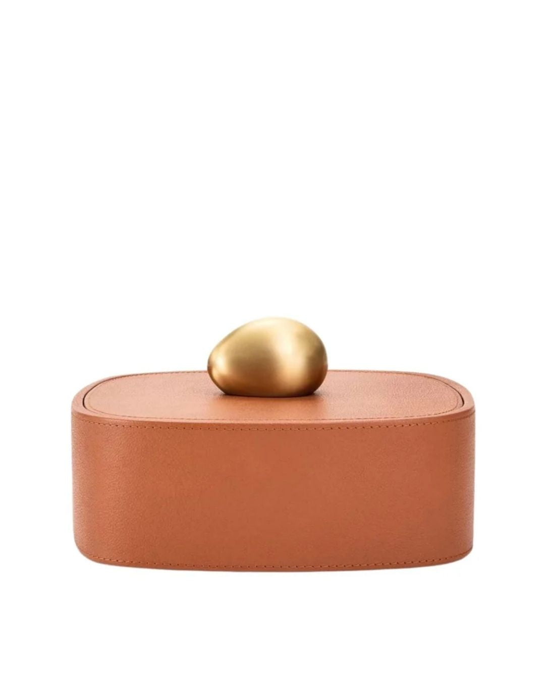 ASSOULINE pebble trinket box in camel pebbled leather. Refined storage accent for desks, shelves, and curated interiors.