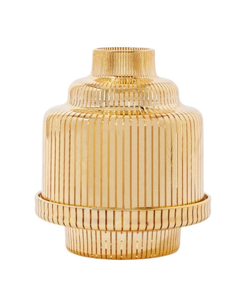 DIPTYQUE golden pyramid candle holder. Sculptural metallic accent designed to elevate candles and refined interiors.