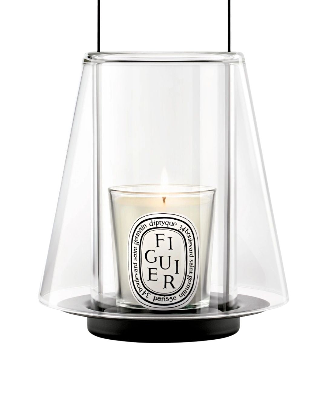 DIPTYQUE traveling lantern. Portable candle holder designed to create warm, ambient light indoors or outdoors.